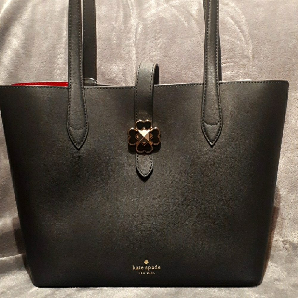 Kate Spade tote with cute flower clasp.